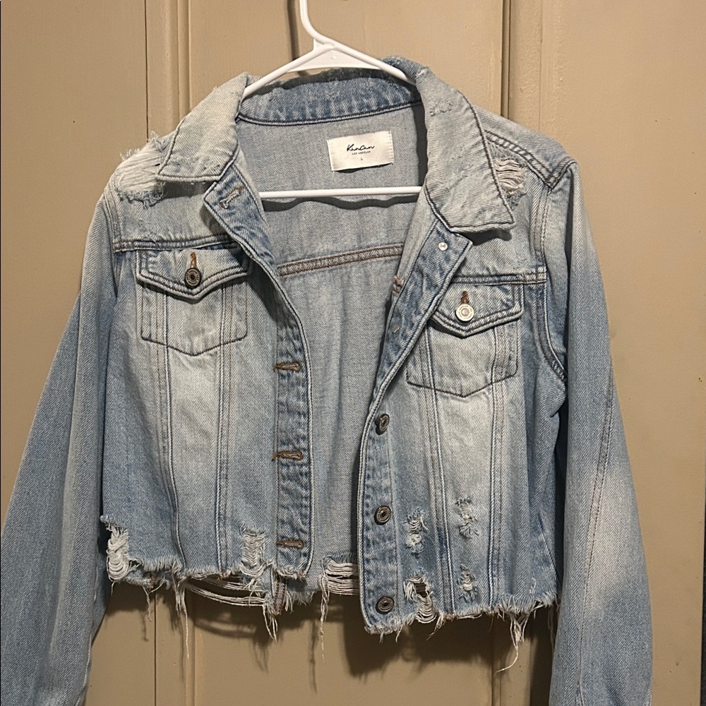 Distressed denim jacket